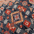 Load image into Gallery viewer, Extreme close-up of The Broken Banner rug yarn, highlighting the dense texture and vibrant crimson, navy, and gold tones in the weave
