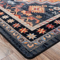Load image into Gallery viewer, Close-up of The Broken Banner rug corner showing sharp crimson, navy, and gold geometric design with clean edging and high-detail weave