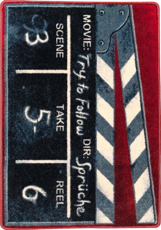 Decorative rug with movie clapperboard design on a red border