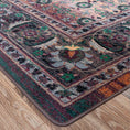 Load image into Gallery viewer, Corner close-up of The Dreamcrafter’s Medallion rug showing ornate border scrollwork and color fade from charcoal to golden amber and green