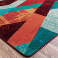 Load image into Gallery viewer, Close-up of The Jester’s Tune rug corner showing vibrant layered diamond shapes in bold jewel tones with a slightly distressed texture