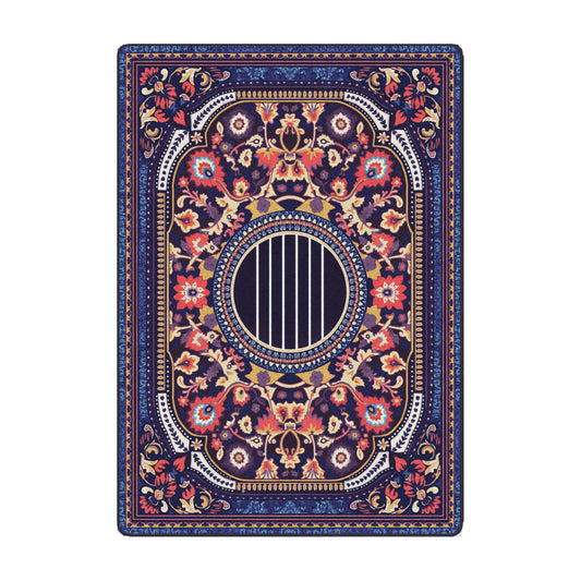 La Esme rug in 5x8 with deep navy base, vivid floral border, and circular striped medallion