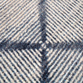 Load image into Gallery viewer, Extreme close-up of the Prismspire rug yarn texture, highlighting the tight weave and fade detailing in navy and cream tones