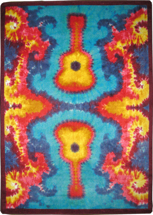 a tie dye looking rug with hippie groovy guitars