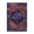 Load image into Gallery viewer, 5x8 area rug with a faded medallion design in indigo, rust, and violet tones, inspired by nomadic caravans and desert twilight scenes