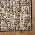 Load image into Gallery viewer, Close-up of a patterned rug on a wooden floor