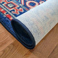 Load image into Gallery viewer, The Alchemist Rug rolled up with the backing exposed, highlighting construction and quality
