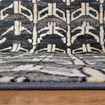 Load image into Gallery viewer, Close-up of Arcade Hunter rug’s surged edging, providing durability and long-lasting wear for high-traffic areas.
