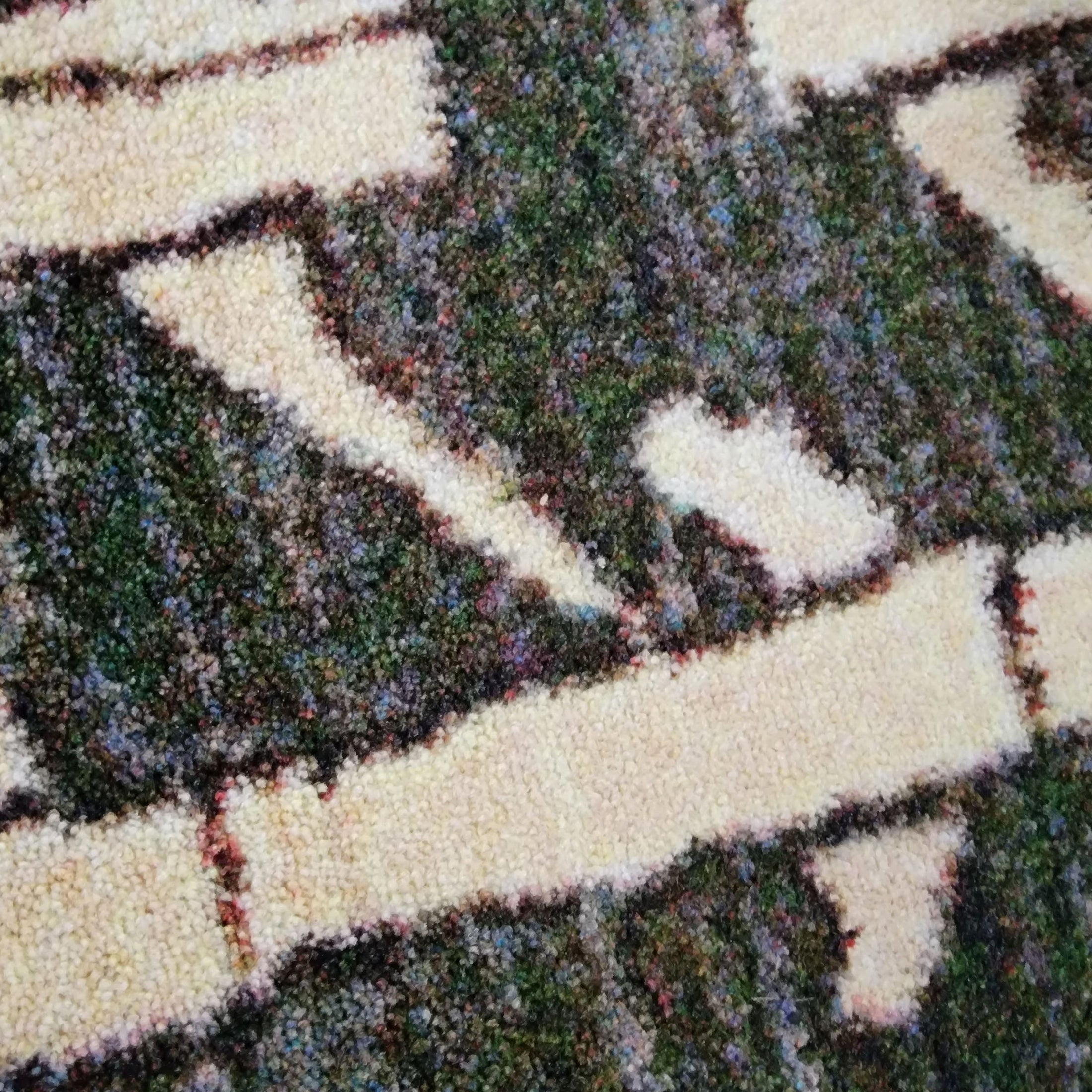 Close-up of the plush texture of the Arcade Hunter rug, highlighting the high-quality craftsmanship and soft feel.
