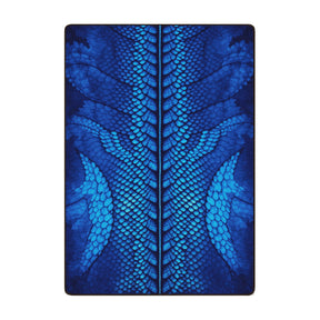 The Blue Dragon Hide Rug in 5x8 size featuring a vivid electric blue scale design with a central dragon spine motif
