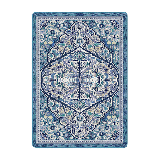 5x8 area rug featuring a symmetrical botanical design with sky blue, green, and cream floral elements in an intricate, nature-inspired pattern