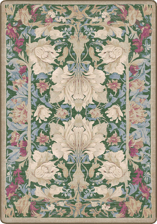 Decorative rug with floral pattern on a green background that feels like it was pulled from a library in the 80s in a reading nook there you can practically smell the card catalog on it