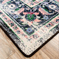 Load image into Gallery viewer, Corner detail of The Floromancer’s Medallion rug showing pink floral motifs against a distressed black background

