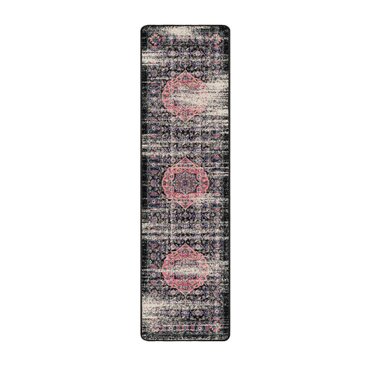 2x8 runner of The Floromancer’s Medallion rug featuring elongated floral scrollwork in pink against a faded black background

