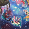 Load image into Gallery viewer, Galacticat Rug in a cozy game room with floating space cats and a galaxy background—perfect for streamers or fantasy decor lovers
