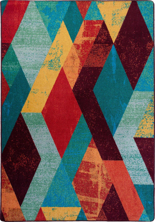 Multicolored geometric patterned rug with red, blue, yellow, and green colors.