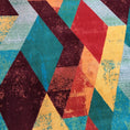 Load image into Gallery viewer, Extreme close-up of The Jester’s Tune rug yarn texture, highlighting the dense weave and rich red and teal tones


