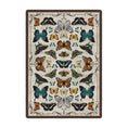 Load image into Gallery viewer, 5x8 area rug featuring a symmetrical arrangement of colorful butterfly specimens on a parchment background, inspired by vintage entomology collections and magical academia


