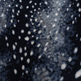 Load image into Gallery viewer, Close-up view of Nocturna’s Hide rug pattern, showing scattered moonlight-like spots against a black and navy background


