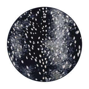  8x8 round version of Nocturna’s Hide rug with a symmetrical, dappled pattern in deep navy and black with pale white spotting