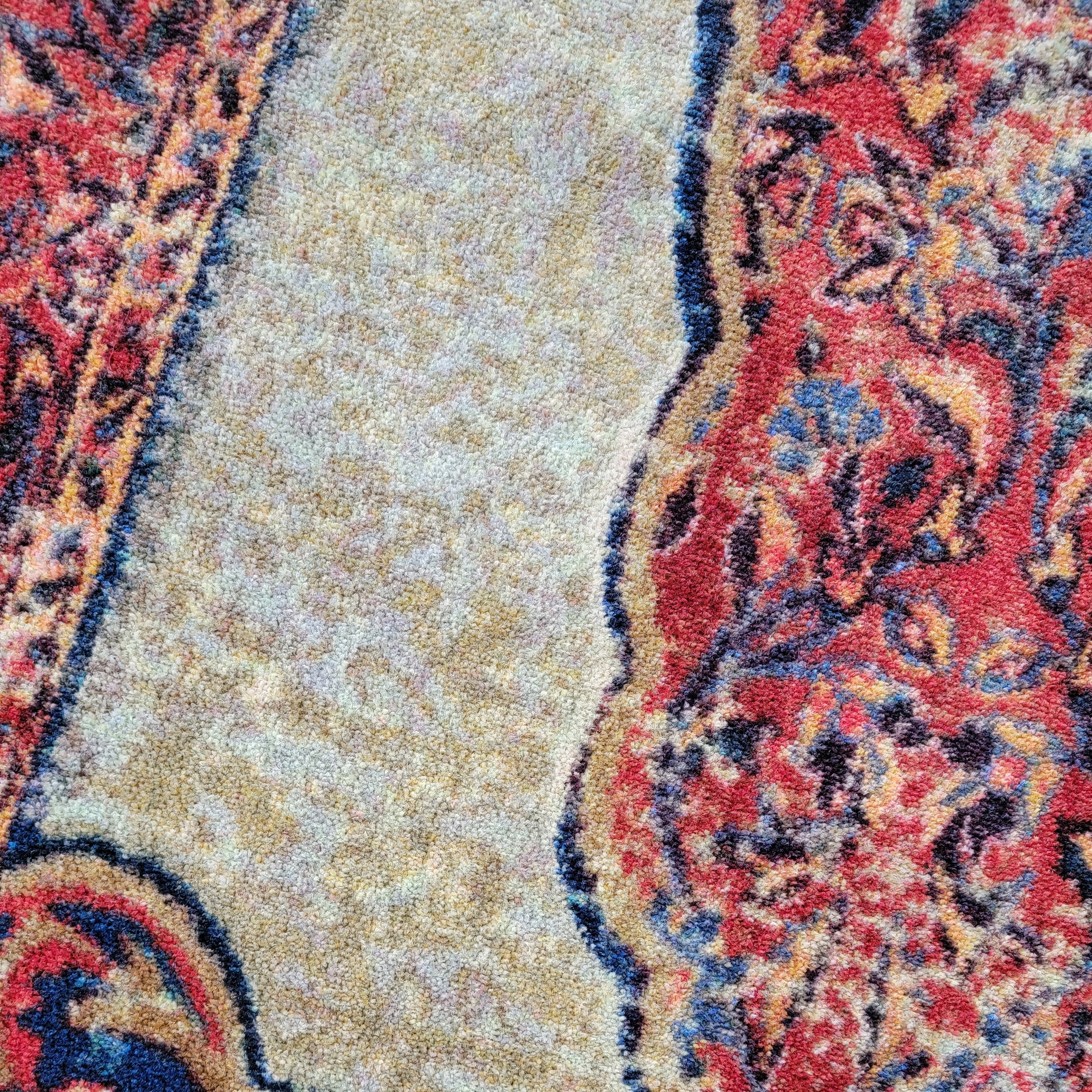 Macro texture shot of The Oathforged Rug highlighting crimson, gold, and parchment threadwork in tight EnduraStran weave