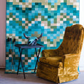 Load image into Gallery viewer, Marketing scene featuring The Pixel Pool rug hanging vertically in the background with an antique chair in front, showcasing its bold pixelated wave pattern in a stylish, editorial setup


