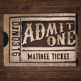 Load image into Gallery viewer, Silver Screen rug in a styled room with wood flooring, featuring a nostalgic matinee ticket design in cream and sepia shades
