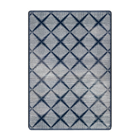 5x8 area rug with a geometric diamond grid pattern and a faded navy gradient on a cream background, blending modern and arcane aesthetics


